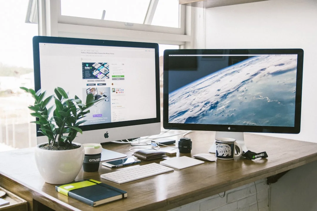 Create the website you’ve always envisioned for what lies ahead. A laptop, MacBook, on top of a portable table with coffee tea mug on the side.